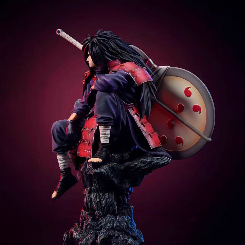 Naruto sitting pose-spotted Uchiha Madara