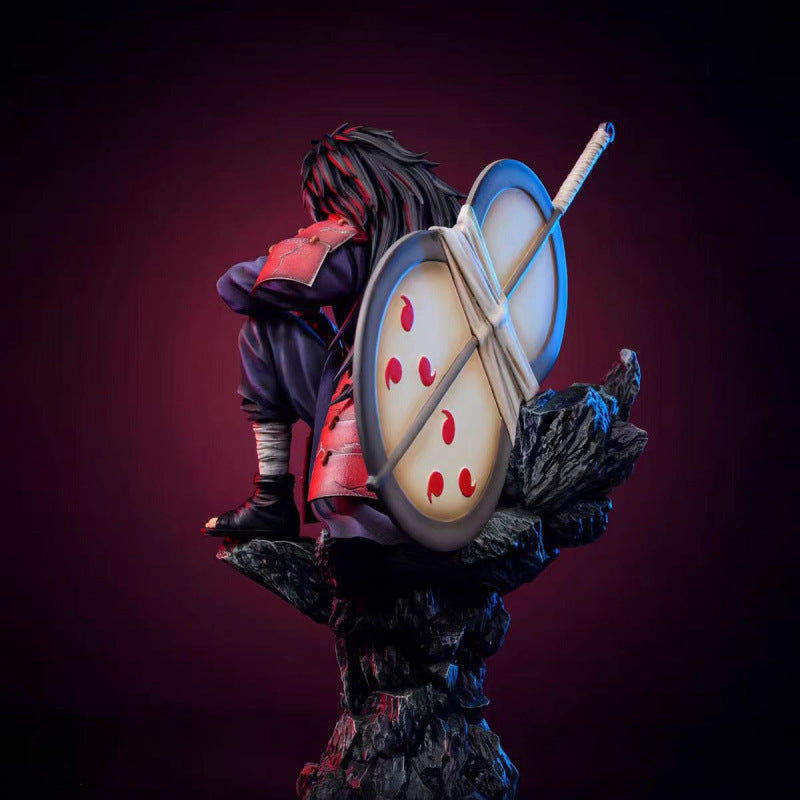 Naruto sitting pose-spotted Uchiha Madara
